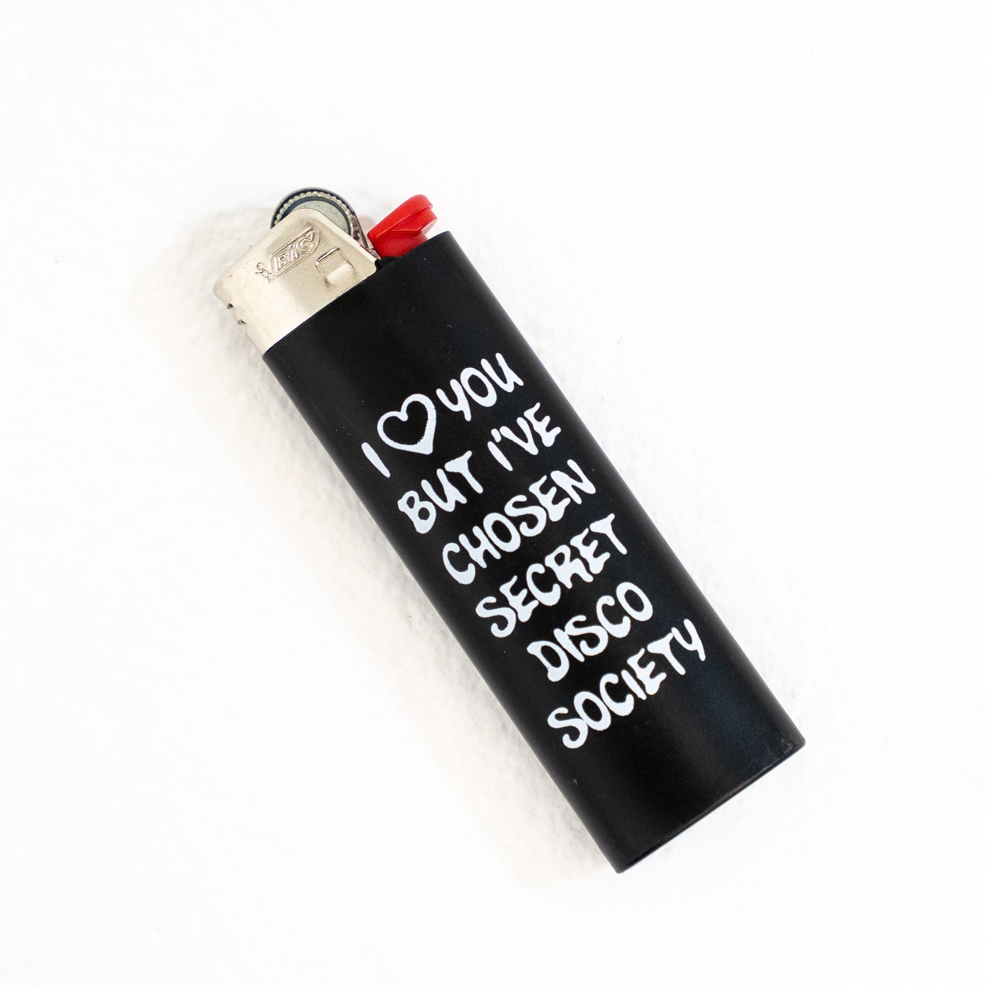 Black lighter with white text on a white background